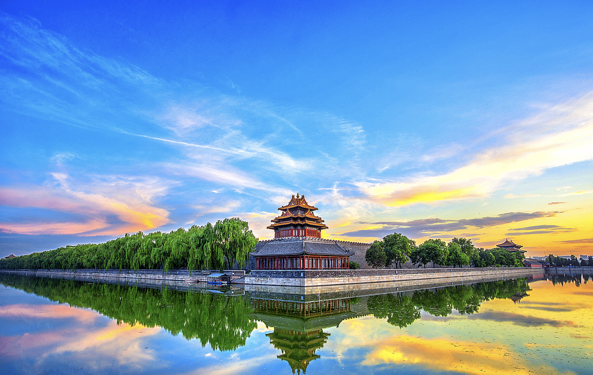 Jingshan Park and Forbidden City moat at sunset in Beijing