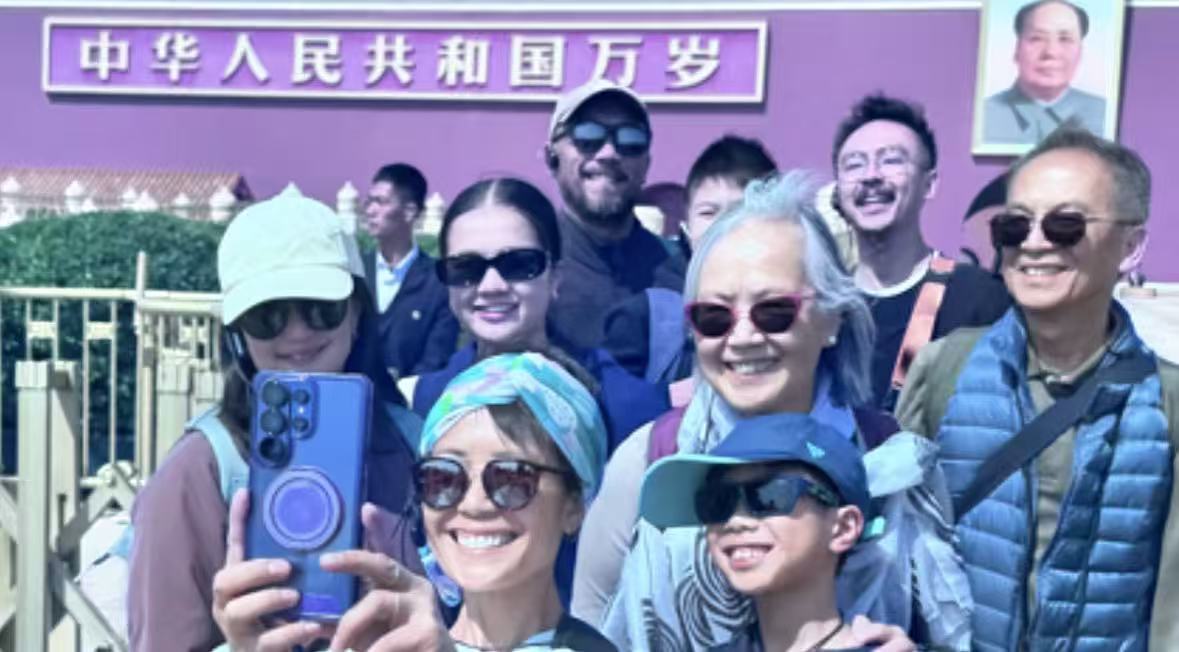 Group guests smiling at Tiananmen Square